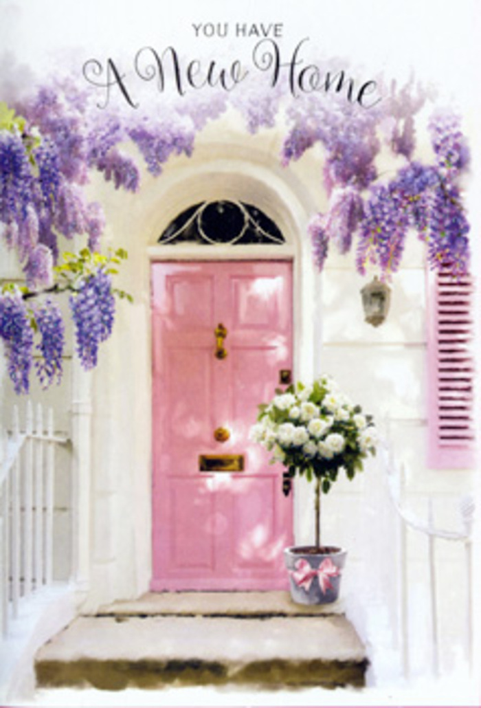 In this scene, a Greenford doorway is transformed into a soft, romantic vignette that seems to capture the very spirit of a fresh start. A pastel pink front door stands tall and inviting, its smooth surface reflecting just enough natural light to glow gently, the way painted wood does after a light afternoon polish. Flanking it, a blush-coloured shutter leans against a whitewashed wall, the pale tones working together to create a calm, welcoming backdrop similar to the peaceful houses dotted around Greenford's neighbourhoods. Draped above, wisteria cascades in long, flowing tendrils of lavender, lilac, and soft purple, each blossom forming part of an airy curtain that softens the edges of the doorway. The blooms appear almost weightless, casting dappled, lace-like shadows onto the wall and steps below, reminiscent of the shade cast by trees along the paths to Ravenor Park. On the doorstep, a simple grey metal bucket anchors the composition. It is filled with a lavish cluster of white and cream roses, arranged with the kind of relaxed precision that signals an experienced florist's touch. The roses are full and plush, their petals loosely layered, some just beginning to unfurl while others are in perfect open bloom. Threads of fresh green foliage weave among them, breaking up the expanse of ivory and adding texture that feels alive and breathing. Around the bucket's base, a length of pink satin ribbon has been tied into a soft bow, its tails resting casually against the step. Its colour echoes the door and shutter, pulling the scene into a cohesive pastel harmony. This quiet arrangement feels like a heartfelt housewarming gesture, perhaps delivered to a new home off Greenford Road, offering not only fragrance and colour but also reassurance, comfort, and the gentle message that this is where new memories will grow.